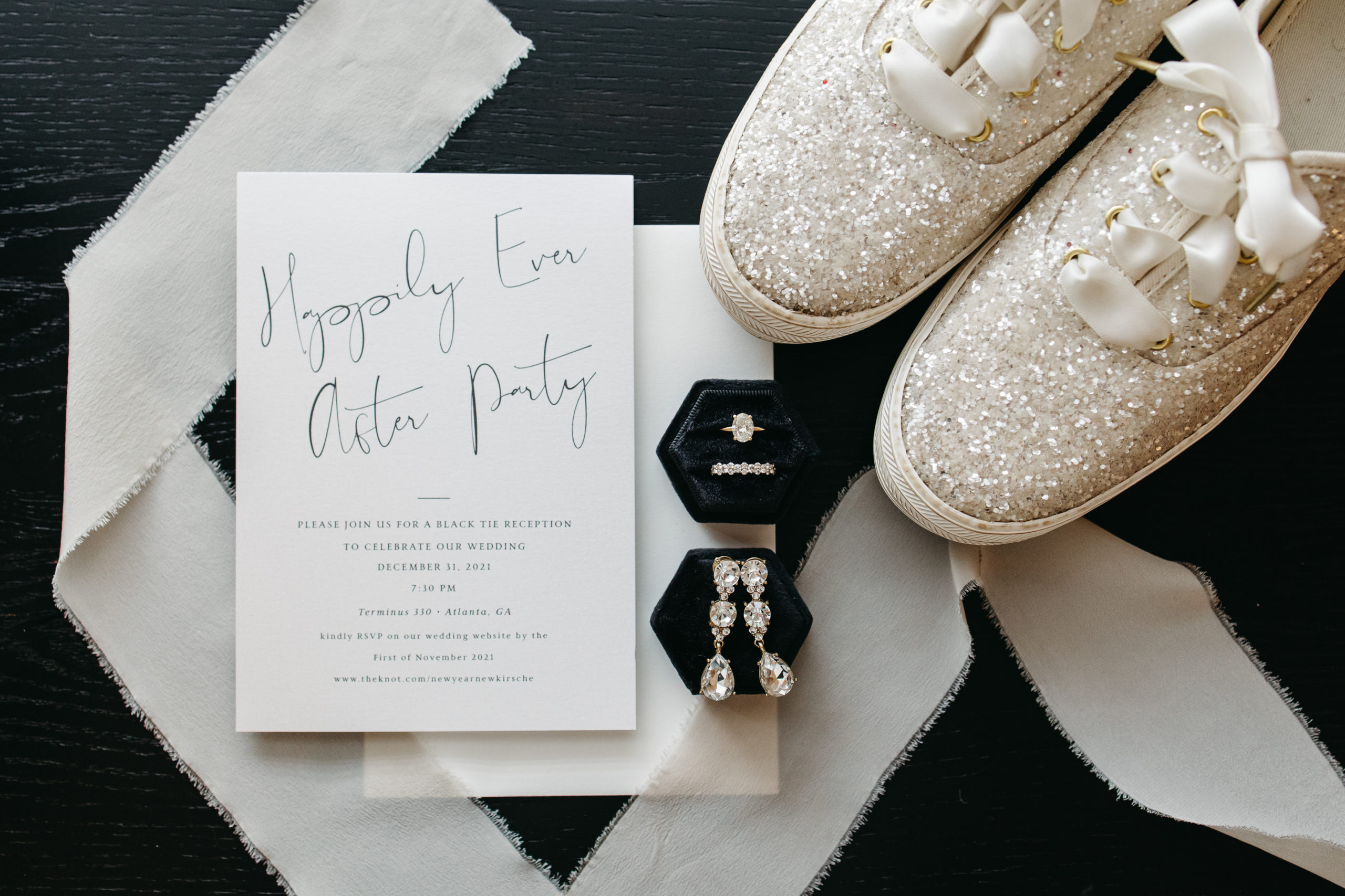 Wedding details with stationery and bridal jewelry and shoes